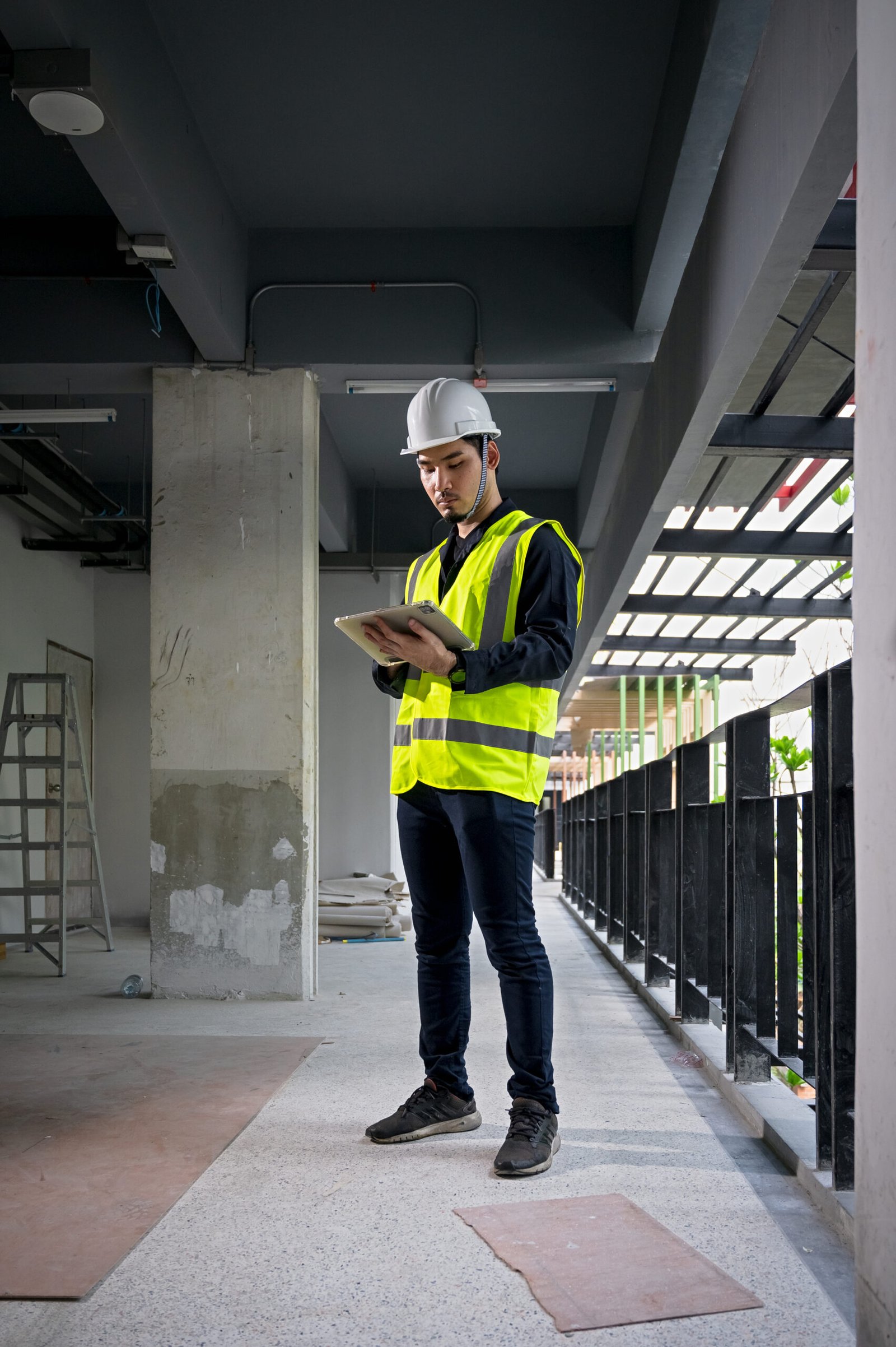 Civil Engineer and Construction Supervisor inspect the internal construction of building at construction site. Construction engineers or architect and Foreman inspect the construction inside building.